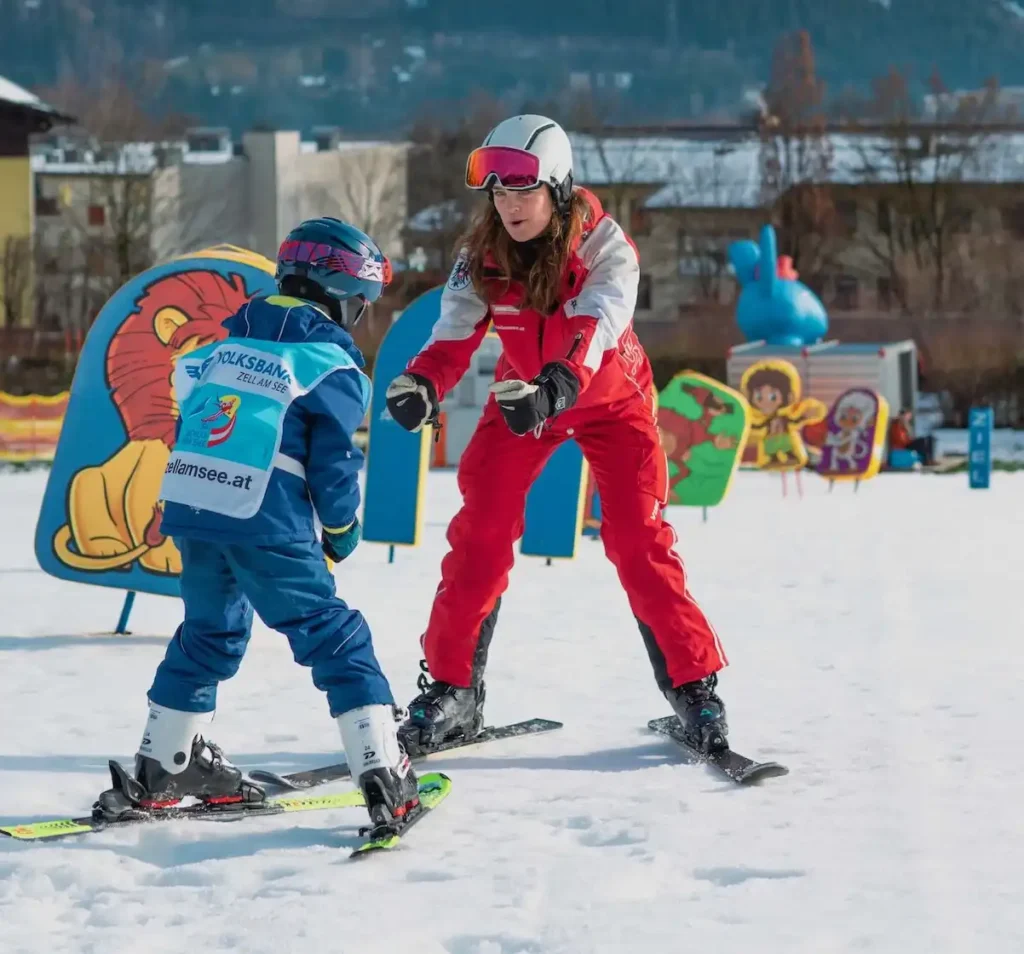 Einheimischenkurs Zell am See, Skilehrerin aus Zell am See mit Kind, Kids on Ski